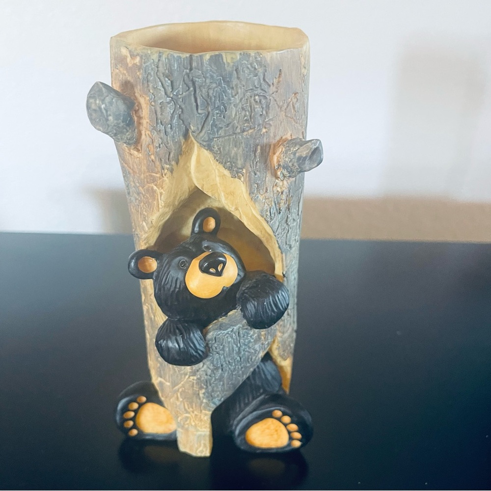 Charming Black and Tan Raccoon Tree Trunk Sculpture